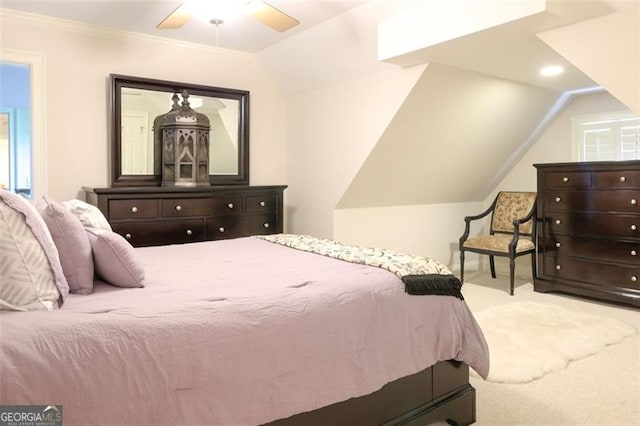 bedroom with carpet flooring, lofted ceiling, and ceiling fan