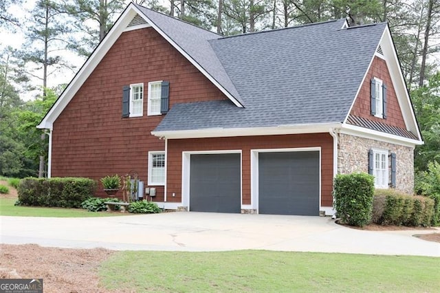 view of front of house with a garage and a front yard