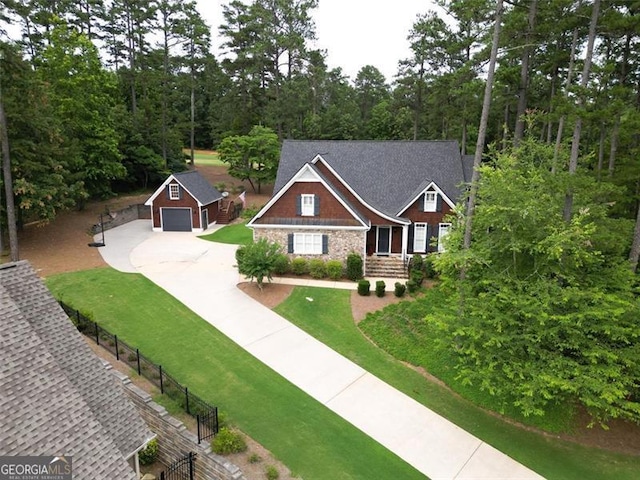 craftsman-style home with a garage and a front yard