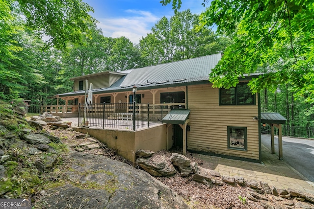 back of house with a patio