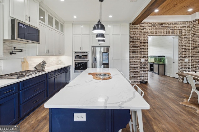2879 Lakeview Rd, Statesboro, GA 30461 - kitchen featuring appliances with stainless steel finishes, blue cabinets, white cabinets, dark wood-type flooring, and recessed lighting