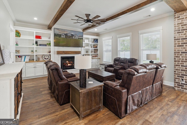 2879 Lakeview Rd, Statesboro, GA 30461 - living area with beamed ceiling, dark wood-style floors, a large fireplace, a ceiling fan, and crown molding