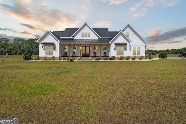 2879 Lakeview Rd, Statesboro, GA 30461 - modern farmhouse style home with a porch, board and batten siding, a front lawn, and a standing seam roof