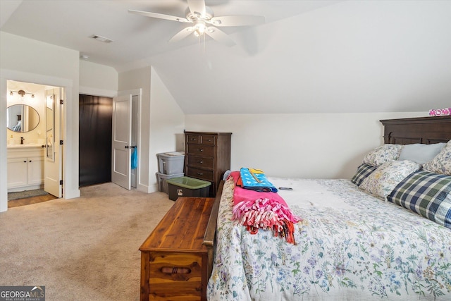 2879 Lakeview Rd, Statesboro, GA 30461 - bedroom featuring carpet, vaulted ceiling, connected bathroom, ceiling fan, and baseboards