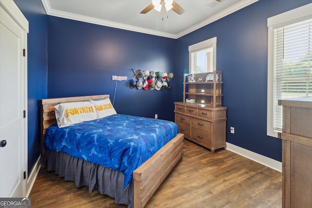 2879 Lakeview Rd, Statesboro, GA 30461 - bedroom featuring wood finished floors, crown molding, baseboards, and a ceiling fan