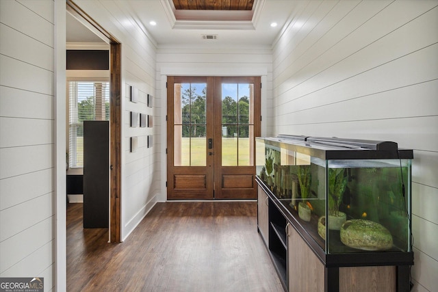 2879 Lakeview Rd, Statesboro, GA 30461 - entryway featuring french doors, crown molding, dark wood-type flooring, wood walls, and a raised ceiling