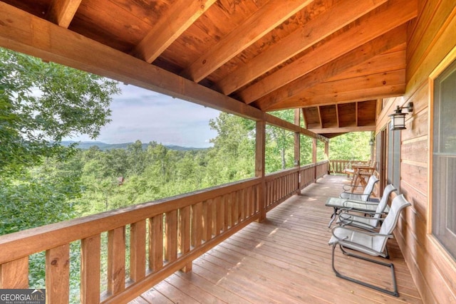 deck featuring a wooded view