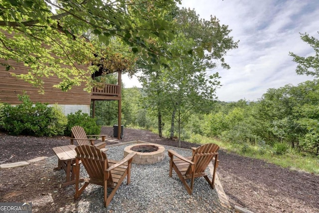 view of patio / terrace featuring an outdoor fire pit