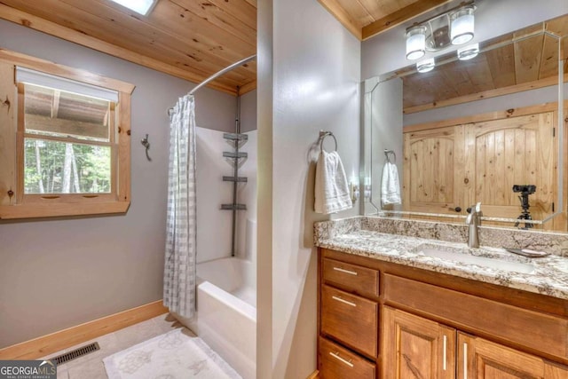 full bath with baseboards, visible vents, wooden ceiling, tile patterned floors, and vanity