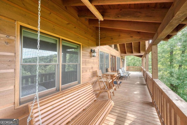 wooden terrace featuring a porch