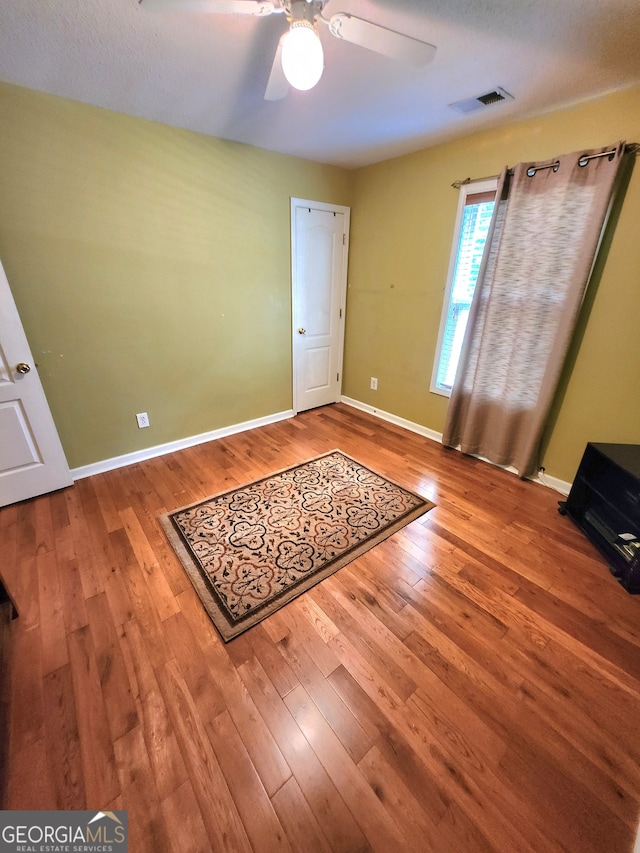 entryway featuring hardwood / wood-style flooring and ceiling fan