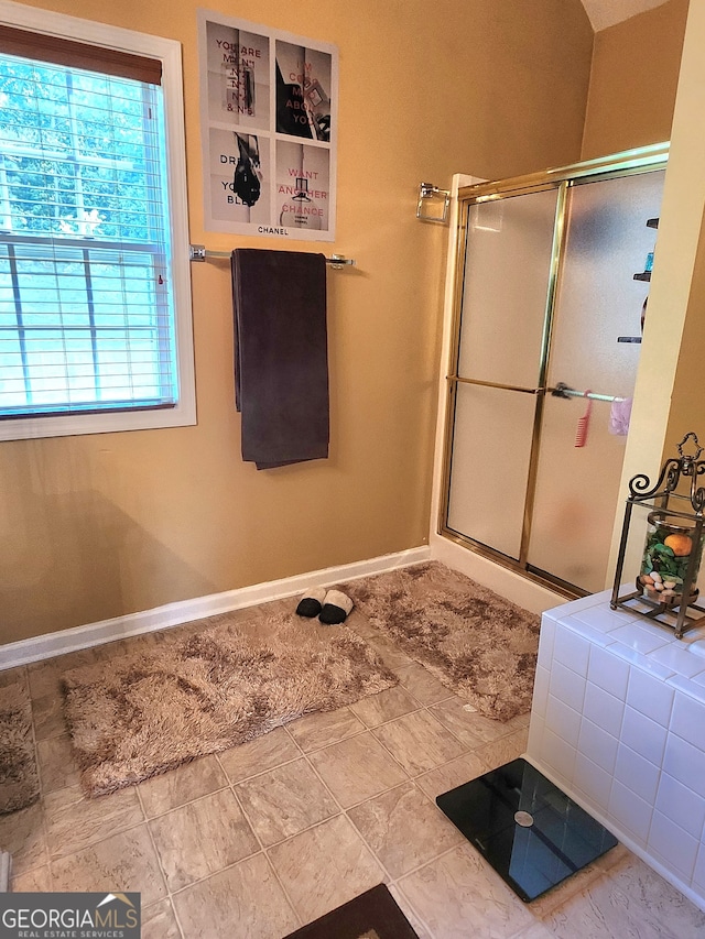 bathroom featuring tile patterned floors and walk in shower