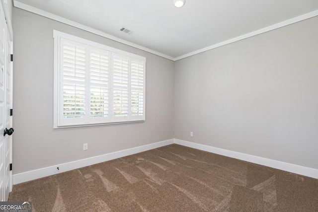 carpeted empty room with crown molding