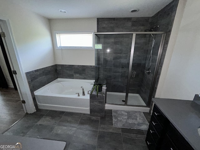 bathroom with independent shower and bath and vanity