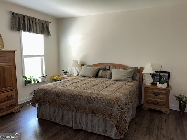 bedroom with dark wood-type flooring