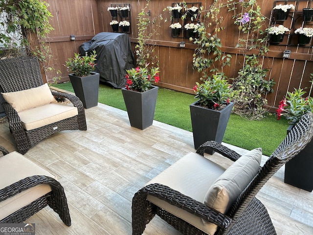 view of patio featuring a grill