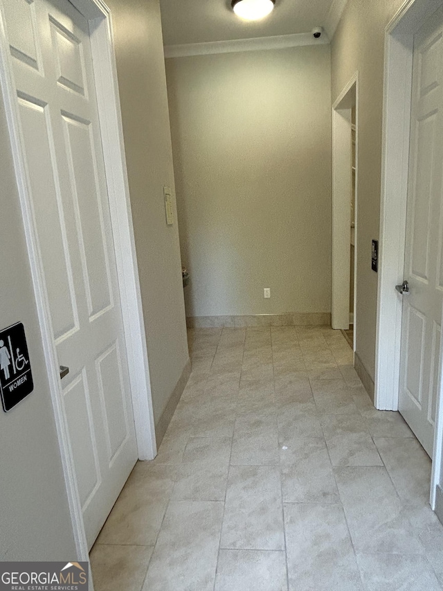 hallway featuring crown molding