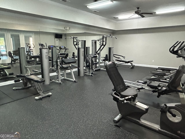 exercise room with ceiling fan and ornamental molding