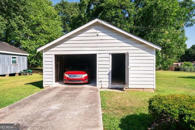 garage featuring a yard