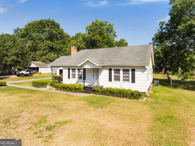 ranch-style home with a front lawn