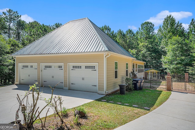 view of side of property with a garage