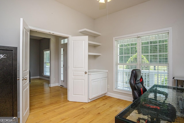 office area with ceiling fan and light hardwood / wood-style floors