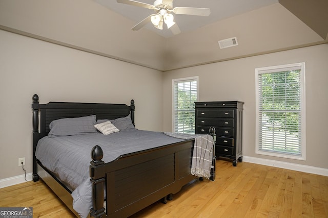 bedroom featuring multiple windows, ceiling fan, and light hardwood / wood-style floors