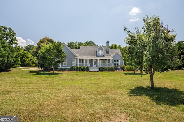 cape cod home with a porch and a front lawn