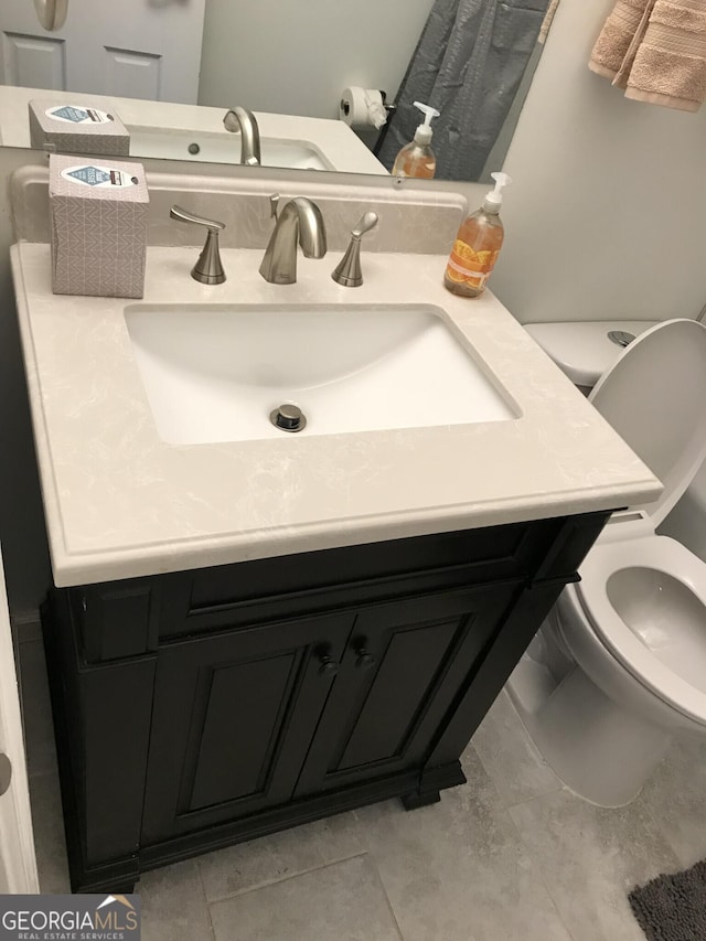 bathroom with vanity and toilet