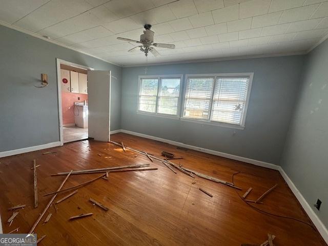 151 Lorrie St, Sardis, GA 30456 - unfurnished bedroom featuring crown molding, wood finished floors, ensuite bathroom, and a ceiling fan