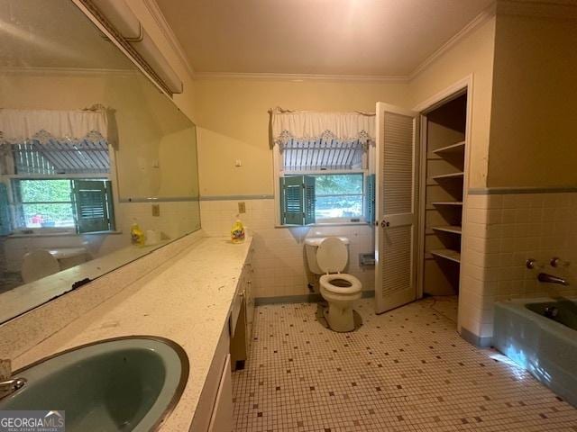151 Lorrie St, Sardis, GA 30456 - full bathroom with ornamental molding, tile walls, healthy amount of natural light, a bath, and vanity