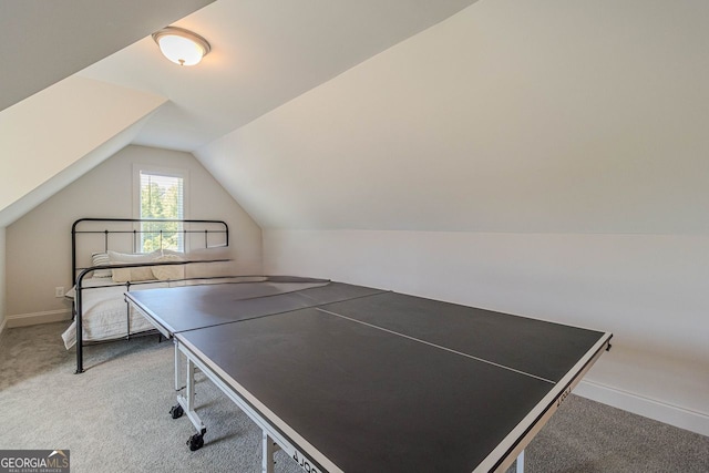 playroom featuring carpet flooring and vaulted ceiling