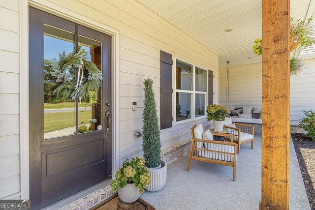 view of patio featuring covered porch