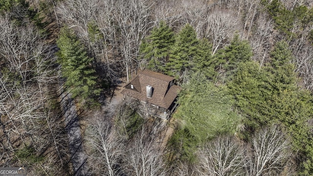 bird's eye view featuring a forest view