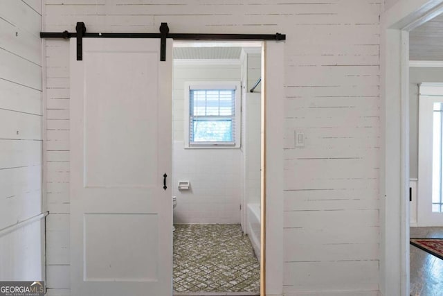 bathroom featuring toilet and wood-type flooring