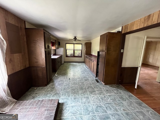 hallway with sink and light hardwood / wood-style floors