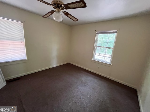 spare room with ceiling fan