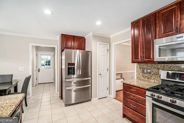 kitchen with crown molding, light tile patterned flooring, light stone counters, and stainless steel appliances