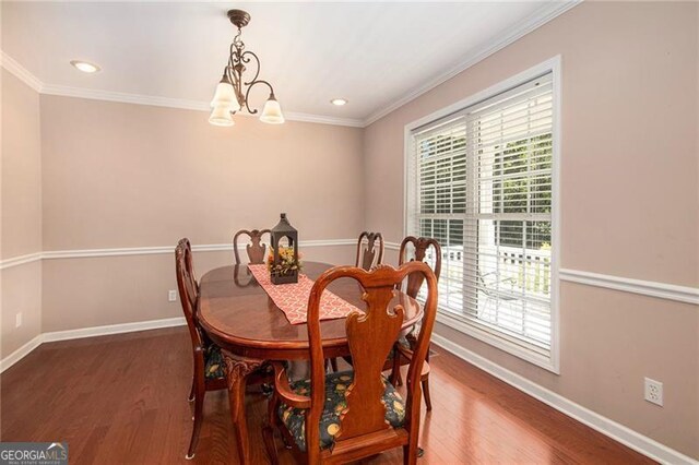 dining room with a notable chandelier, dark hardwood / wood-style floors, and plenty of natural light