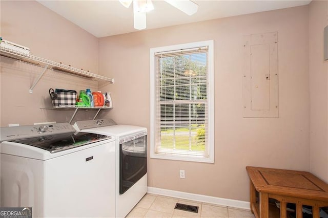 washroom featuring washing machine and dryer, electric panel, ceiling fan, and light tile patterned flooring