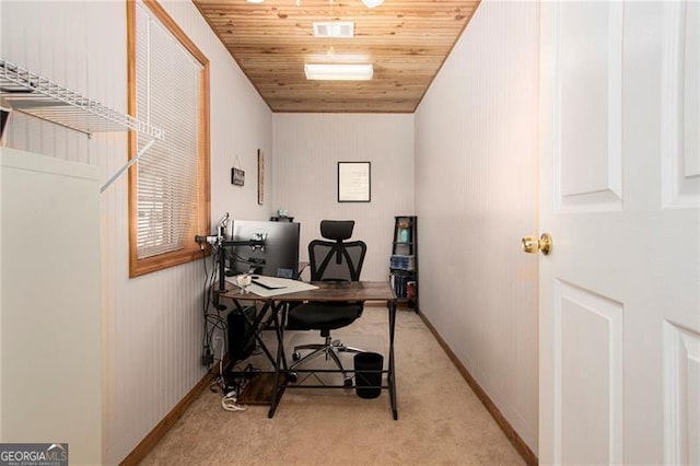 carpeted home office with wooden ceiling