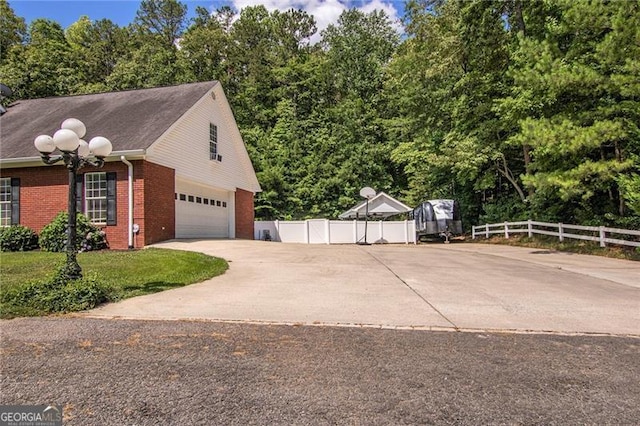 view of side of home with a garage