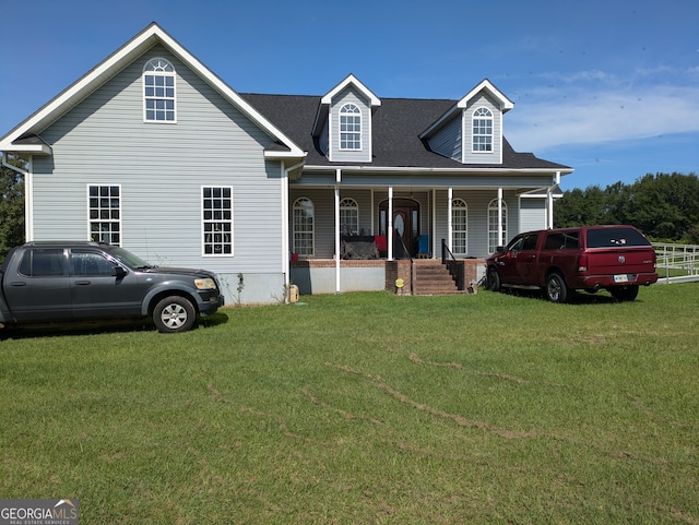 view of front of home with a porch and a front lawn