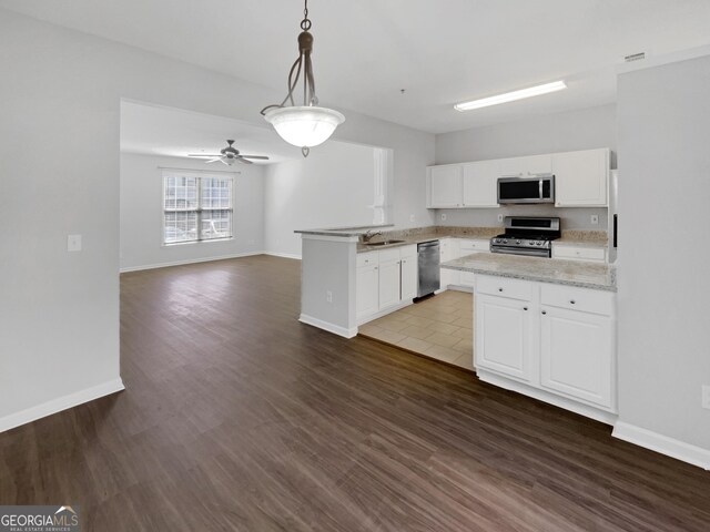 kitchen featuring white cabinetry, stainless steel appliances, sink, and light tile patterned floors