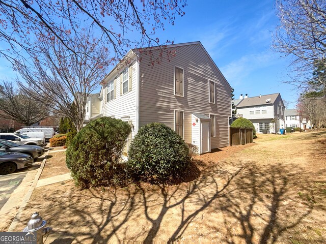 view of property exterior with a residential view