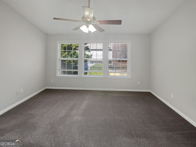 unfurnished living room featuring ceiling fan, hardwood / wood-style floors, and a fireplace