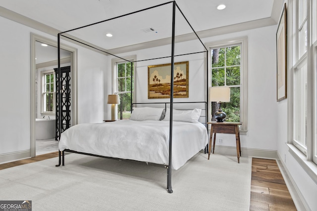 bedroom featuring hardwood / wood-style flooring