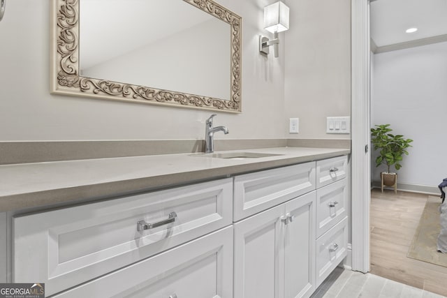 bathroom featuring hardwood / wood-style floors and vanity