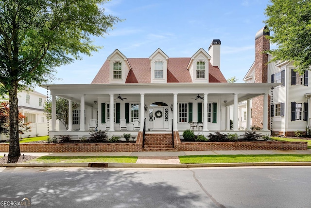 view of front of property with ceiling fan and covered porch