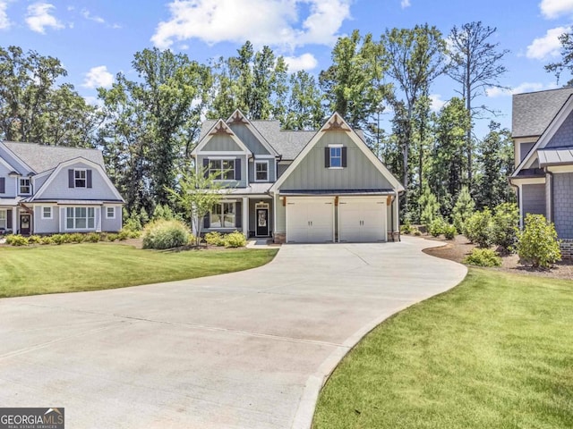 view of front of home with driveway, an attached garage, a front lawn, and board and batten siding